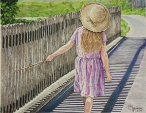 a young girl takes a summer stroll playing a stick along an old picket fence